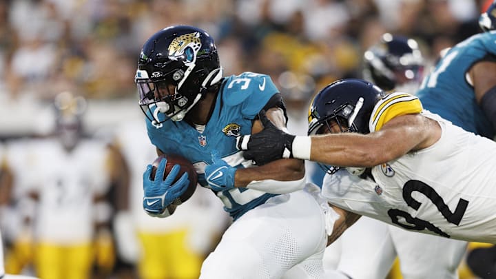 Aug 9, 2025; Jacksonville, Florida, USA; Pittsburgh Steelers defensive tackle Isaiahh Loudermilk (92) tackles Jacksonville Jaguars running back Bhayshul Tuten (33) during the second quarter at EverBank Stadium. Mandatory Credit: Morgan Tencza-Imagn Images