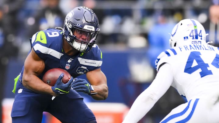 Dec 14, 2025; Seattle, Washington, USA; Seattle Seahawks running back Kenneth Walker III (9) rushes against the Indianapolis Colts during the third quarter at Lumen Field. Dec 14, 2025; Seattle, Washington, USA; Seattle Seahawks running back Kenneth Walker III (9) rushes against the Indianapolis Colts during the third quarter at Lumen Field.