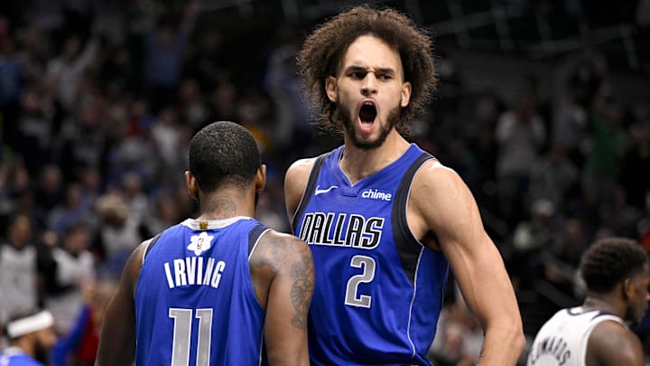 Dec 25, 2024; Dallas, Texas, USA; Dallas Mavericks guard Kyrie Irving (11) and center Dereck Lively II (2) in action during the game between the Dallas Mavericks and the Minnesota Timberwolves at the American Airlines Center. Mandatory Credit: Jerome Miron-Imagn Images