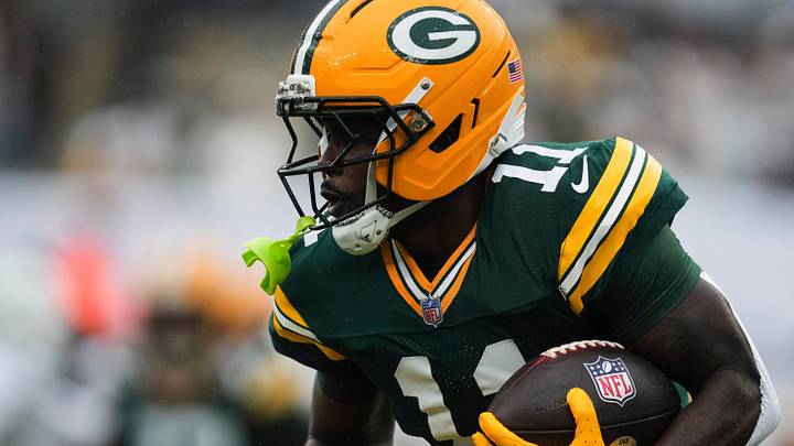Green Bay Packers wide receiver Jayden Reed (11) runs with the ball during a game against the New York Jets. Green Bay Packers wide receiver Jayden Reed (11) runs with the ball during a game against the New York Jets.