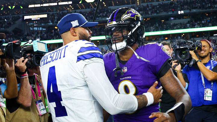 Dallas Cowboys quarterback Dak Prescott (4) hugs Baltimore Ravens quarterback Lamar Jackson (8) after the game at AT&T Stadium. 