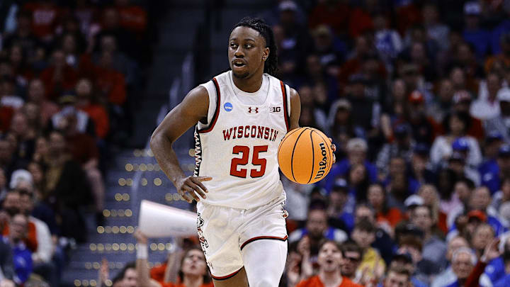 Mar 22, 2025; Denver, CO, USA; Wisconsin Badgers guard John Blackwell (25) dribbles the ball against the Brigham Young Cougars during the first half in the second round of the NCAA Tournament  at Ball Arena.