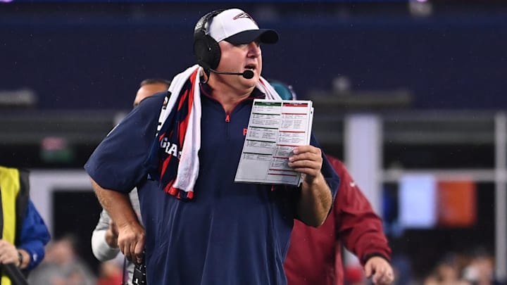 August 8, 2024; Foxborough, MA, USA;  New England Patriots offensive coordinator Alex Van Pelt works on the sideline during the first half against the Carolina Panthers at Gillette Stadium. Mandatory Credit: Eric Canha-Imagn Images