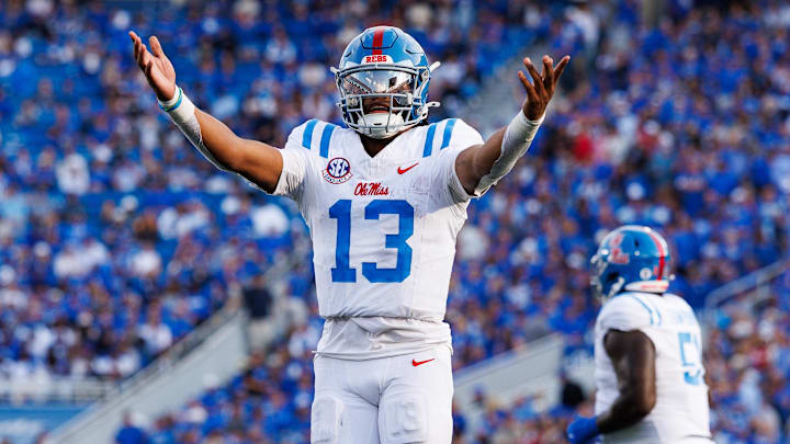 Sep 6, 2025; Lexington, Kentucky, USA; Mississippi Rebels quarterback Austin Simmons (13) celebrates after scoring a touchdown during the fourth quarter against the Kentucky Wildcats at Kroger Field. Mandatory Credit: Jordan Prather-Imagn Images