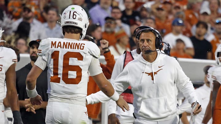 Texas Longhorns head coach Steve Sarkisian reacts with Texas Longhorns quarterback Arch Manning  during the fourth quarter against the Mississippi State Bulldogs at Davis Wade Stadium at Scott Field.