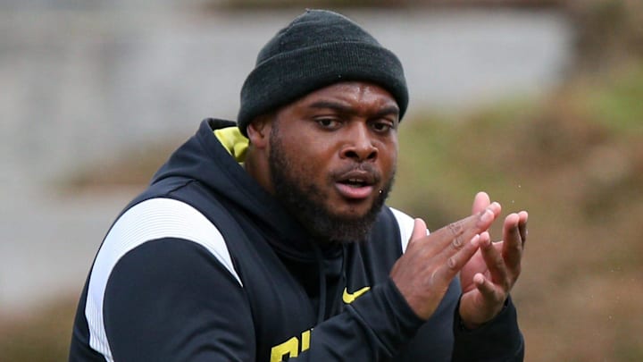 Oregon offensive line coach A'lique Terry leads a workout during spring practice with the Ducks in Eugene, Ore. Thursday, April, 13, 2023.

Sports Oregon Spring Practice