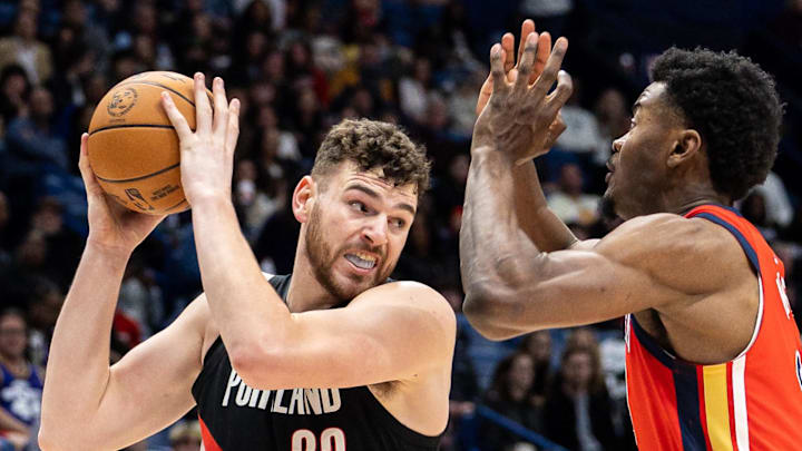 Portland Trail Blazers center Donovan Clingan dribbles against New Orleans Pelicans center Yves Missi.