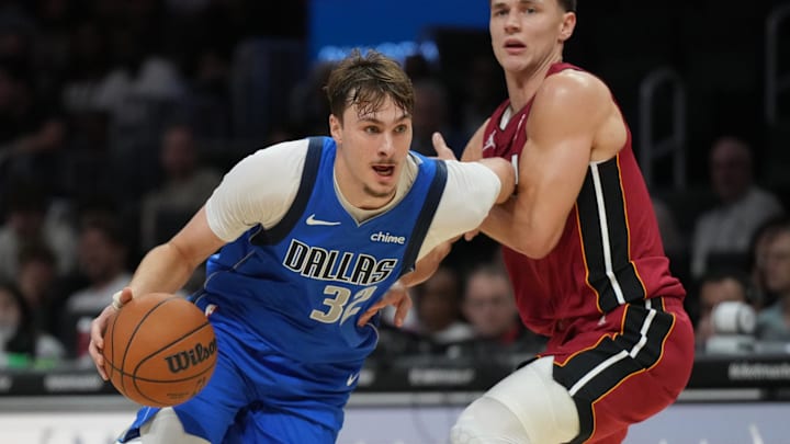 Nov 24, 2025; Miami, Florida, USA; Dallas Mavericks forward Cooper Flagg (32) drives to the basket against the Miami Heat during the second half at Kaseya Center. Mandatory Credit: Jim Rassol-Imagn Images