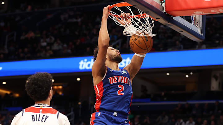 Mar 17, 2026; Washington, District of Columbia, USA; Detroit Pistons guard Cade Cunningham (2) dunks over Washington Wizards guard Will Riley (27) and guard Tre Johnson (12) during the first half at Capital One Arena. Mandatory Credit: Daniel Kucin Jr.-Imagn Images