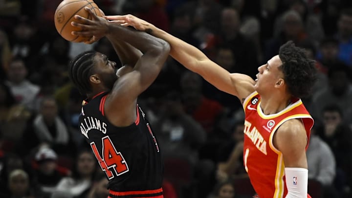 Patrick Williams #44 of the Chicago Bulls goes up against Jalen Johnson #1 of the Atlanta Hawks.