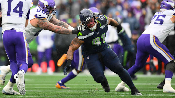 Dec 22, 2024; Seattle, Washington, USA; Minnesota Vikings guard Dalton Risner (66) blocks Seattle Seahawks defensive tackle Byron Murphy II (91) during the first half at Lumen Field.