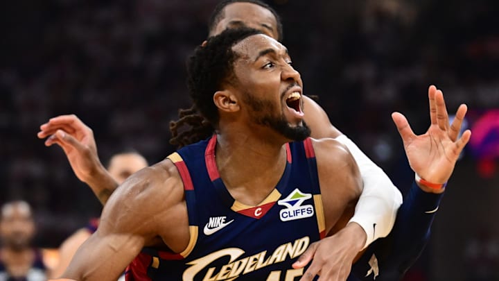 May 9, 2026; Cleveland, Ohio, USA; Cleveland Cavaliers guard Donovan Mitchell (45) drives to the basket against Detroit Pistons guard Daniss Jenkins (24) during the second half of game three in the second round of the 2026 NBA Playoffs at Rocket Arena. Mandatory Credit: Ken Blaze-Imagn Images