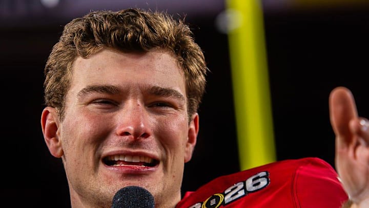 Indiana's Fernando Mendoza (15) talks to the crowd on the podium after the College Football Playoff National Championship college football game at Hard Rock Stadium in Miami Gardens on Monday, Jan. 19, 2026.