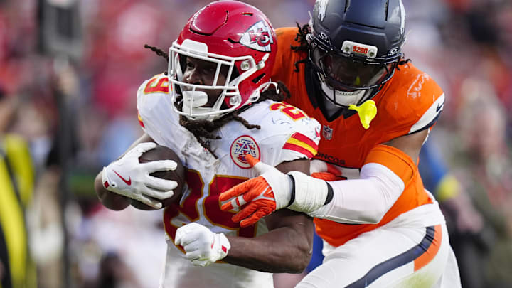Nov 16, 2025; Denver, Colorado, USA; Denver Broncos linebacker Nik Bonitto (15) tackles Kansas City Chiefs running back Kareem Hunt (29) carries the ball in the third quarter at Empower Field at Mile High. Nov 16, 2025; Denver, Colorado, USA; Denver Broncos linebacker Nik Bonitto (15) tackles Kansas City Chiefs running back Kareem Hunt (29) carries the ball in the third quarter at Empower Field at Mile High.