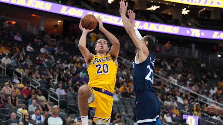 Oct 6, 2022; Las Vegas, Nevada, USA; Los Angeles Lakers forward Cole Swider (20) shoots against Minnesota Timberwolves guard CJ Elleby (22) during a preseason game at T-Mobile Arena. Mandatory Credit: Stephen R. Sylvanie-Imagn Images