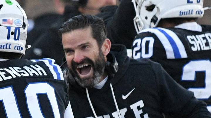 Nov 29, 2025; Durham, North Carolina, USA;  Duke Blue Devils head coach Manny Diaz celebrates Duke Blue Devils quarter back Darian Mensah's (10) touchdown against the Wake Forest Demon Deacons during the second quarter at Wallace Wade Stadium. Mandatory Credit: Zachary Taft-Imagn Images