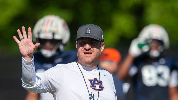 Auburn Tigers head coach Alex Golesh talks with his team during practice at Woltosz Football Performance Center in Auburn, Ala. on Thursday, April 16, 2026.