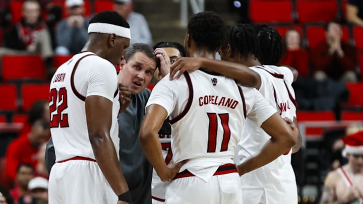 Dec 6, 2025; Raleigh, North Carolina, USA; NC State Wolfpack huddle with head coach Will Wade during the second half of the game against UNC Asheville Bulldogs at Lenovo Center. Mandatory Credit: Jaylynn Nash-Imagn Images