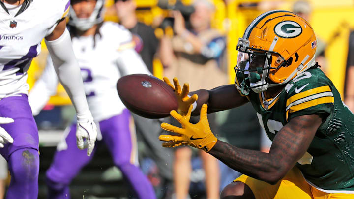 Green Bay Packers wide receiver Dontayvion Wicks (13) scores a touchdown against the Vikings last season. Green Bay Packers wide receiver Dontayvion Wicks (13) scores a touchdown against the Vikings last season.