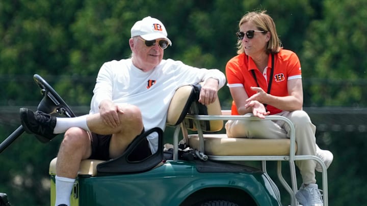Cincinnati Bengals executives Mike Brown and his daughter Katie Blackburn talk on the sideline during a session of organized team activities on the Bengals practice field at Paycor Stadium in downtown Cincinnati on Tuesday, June 3, 2025. Cincinnati Bengals executives Mike Brown and his daughter Katie Blackburn talk on the sideline during a session of organized team activities on the Bengals practice field at Paycor Stadium in downtown Cincinnati on Tuesday, June 3, 2025.