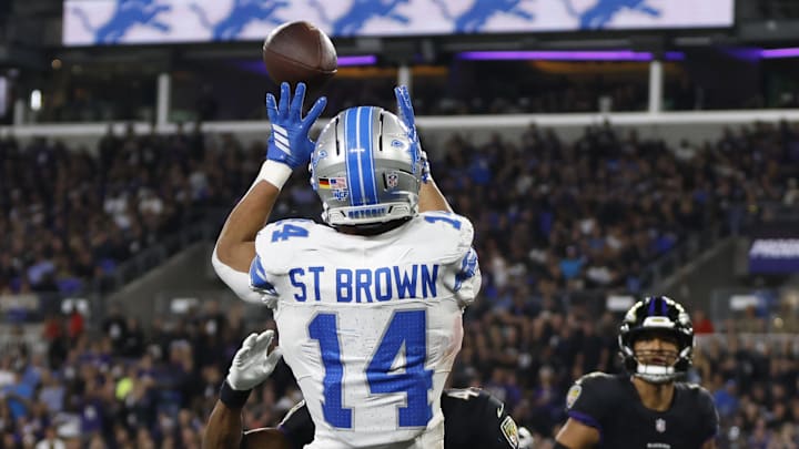 Detroit Lions wide receiver Amon-Ra St. Brown (14) makes a touchdown catch against Baltimore Ravens 
