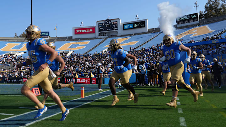 Sep 14, 2024; Pasadena, California, USA; UCLA Bruins players enter the field during the game against the Indiana Hoosiers at Rose Bowl. Mandatory Credit: Kirby Lee-Imagn Images