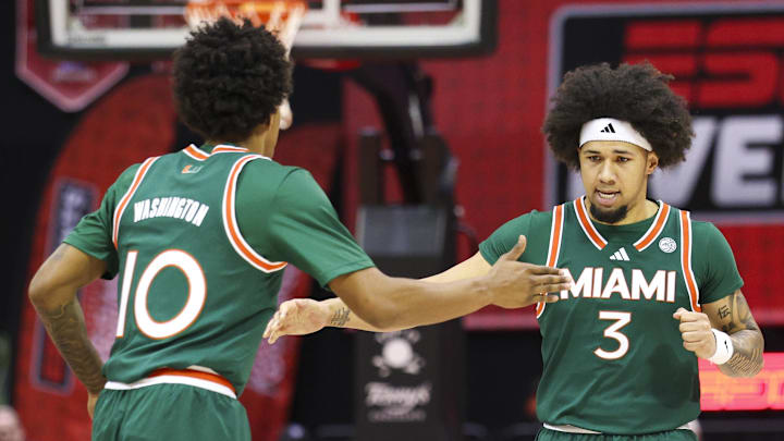 Nov 28, 2025; Kissimmee, FL, USA; Miami (FL) Hurricanes guard Tru Washington (10) and guard Tre Donaldson (3) react after a basket against the Georgetown Hoyas in the first half during the ESPN Events Invitational at State Farm Field House. Mandatory Credit: Nathan Ray Seebeck-Imagn Images