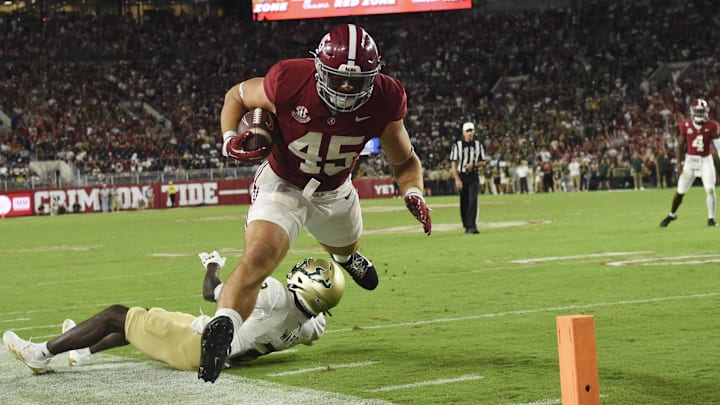 Sep 7, 2024; Tuscaloosa, Alabama, USA;  Alabama Crimson Tide tight end Robbie Ouzts (45) is driven out of bounds short of the goal line by South Florida Bulls defensive back Tavin Ward (2) at Bryant-Denny Stadium. Alabama won 42-16.