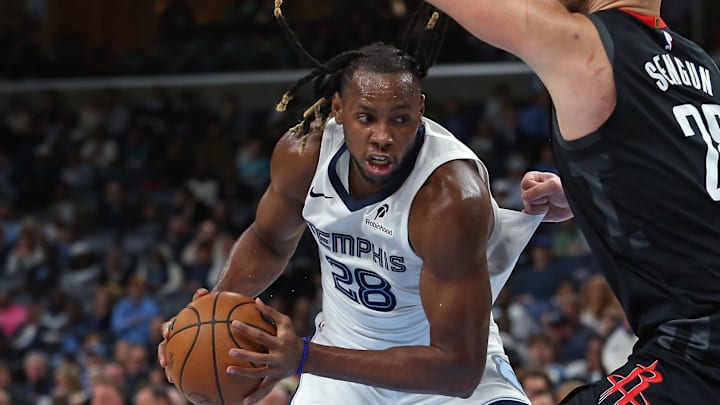 Nov 5, 2025; Memphis, Tennessee, USA; Memphis Grizzlies center Charles Bassey (28) drives to the basket as Houston Rockets center Alperen Sengun (28) defends during the second quarter at FedExForum. Mandatory Credit: Petre Thomas-Imagn Images
