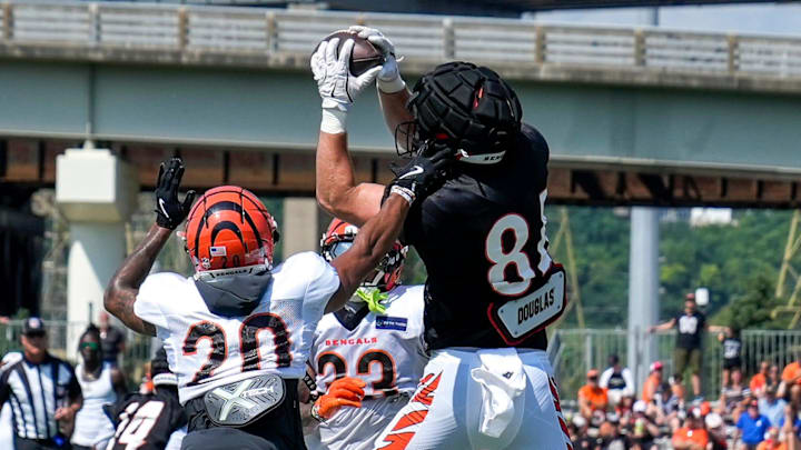 Cincinnati Bengals tight end Tanner McLachlan (84) makes a catch in the end zone over cornerback DJ Turner II (20) during a preseason training camp practice in downtown Cincinnati on Wednesday, July 30, 2025.