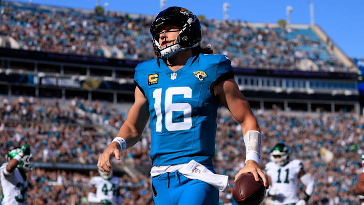 Jacksonville Jaguars quarterback Trevor Lawrence (16) scores a touchdown on a keeper during the first quarter of an NFL football matchup at EverBank Stadium, Sunday, Dec. 14, 2025, in Jacksonville, Fla. [Corey Perrine/Florida Times-Union]