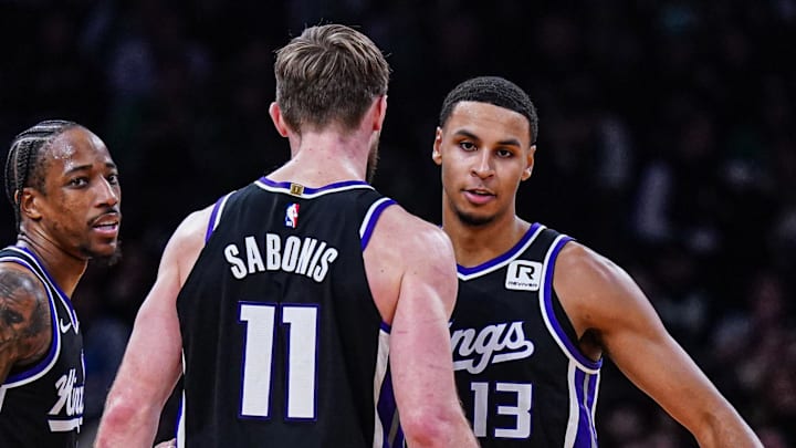 Jan 10, 2025; Boston, Massachusetts, USA; Sacramento Kings forward DeMar DeRozan (10), forward Keegan Murray (13) and forward Domantas Sabonis (11) react after defeating the Boston Celtics at TD Garden.