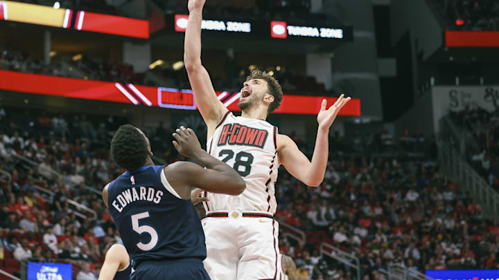 Dec 27, 2024; Houston, Texas, USA; Houston Rockets center Alperen Sengun (28) shoots the ball over Minnesota Timberwolves guard Anthony Edwards (5) during the fourth quarter at Toyota Center. Mandatory Credit: Troy Taormina-Imagn Images