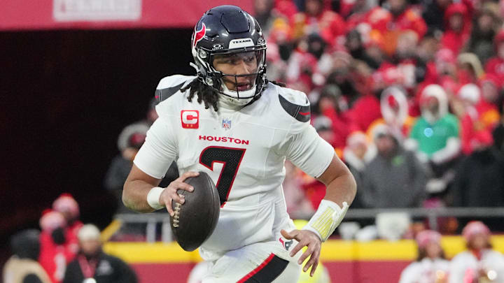 Jan 18, 2025; Kansas City, Missouri, USA; Houston Texans quarterback C.J. Stroud (7) rolls out to throw against the Kansas City Chiefs during the third quarter of a 2025 AFC divisional round game at GEHA Field at Arrowhead Stadium. Mandatory Credit: Denny Medley-Imagn Images
