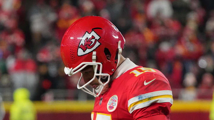 Dec 7, 2025; Kansas City, Missouri, USA; Kansas City Chiefs quarterback Patrick Mahomes (15) lowers his head during the fourth quarter against the Houston Texans at GEHA Field at Arrowhead Stadium. Mandatory Credit: Denny Medley-Imagn Images