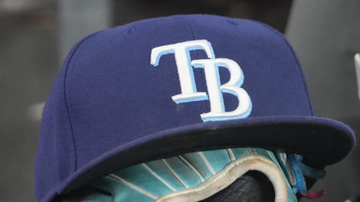 Sep 26, 2025; Toronto, Ontario, CAN; The hat and glove of Tampa Bay Rays third baseman Junior Caminero (13) in the dugout during the game against the Toronto Blue Jays at Rogers Centre. 