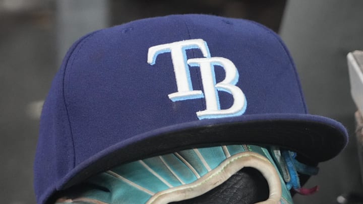 Sep 26, 2025; Toronto, Ontario, CAN; The hat and glove of Tampa Bay Rays third baseman Junior Caminero (13) in the dugout during the game against the Toronto Blue Jays at Rogers Centre. 