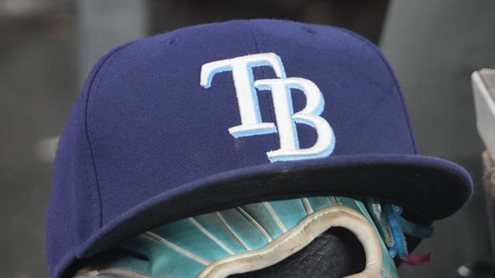 Sep 26, 2025; Toronto, Ontario, CAN; The hat and glove of Tampa Bay Rays third baseman Junior Caminero (13) in the dugout during the game against the Toronto Blue Jays at Rogers Centre. Sep 26, 2025; Toronto, Ontario, CAN; The hat and glove of Tampa Bay Rays third baseman Junior Caminero (13) in the dugout during the game against the Toronto Blue Jays at Rogers Centre.