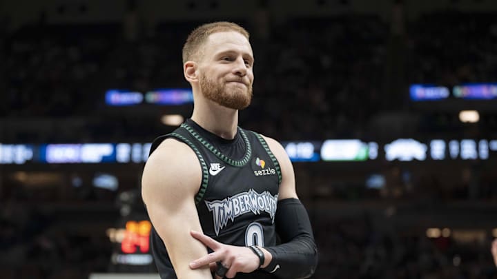 Dec 23, 2025; Minneapolis, Minnesota, USA; Minnesota Timberwolves guard Donte Divincenzo (0) celebrates making a shot against the New York Knicks in the second half at Target Center. Mandatory Credit: Jesse Johnson-Imagn Images