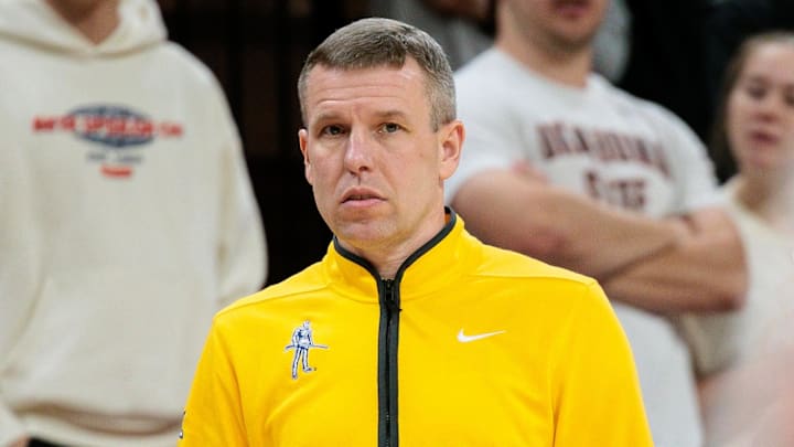 Feb 24, 2026; Stillwater, Oklahoma, USA; West Virginia Mountaineers coach Ross Hodge watches game play during the first half against the Oklahoma State Cowboys at Gallagher-Iba Arena. Mandatory Credit: William Purnell-Imagn Images Feb 24, 2026; Stillwater, Oklahoma, USA; West Virginia Mountaineers coach Ross Hodge watches game play during the first half against the Oklahoma State Cowboys at Gallagher-Iba Arena. Mandatory Credit: William Purnell-Imagn Images