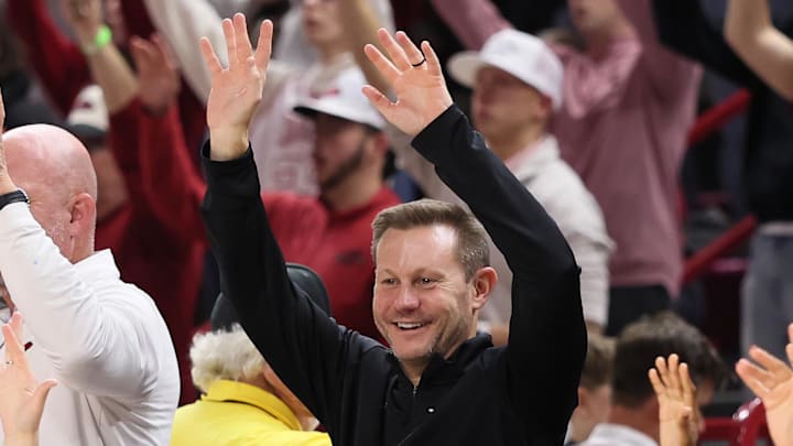Arkansas Razorbacks coach Ryan Silverfield “Calls the Hogs” during the second half against the James Madison Dukes at Bud Walton Arena in Fayetteville, Ark.