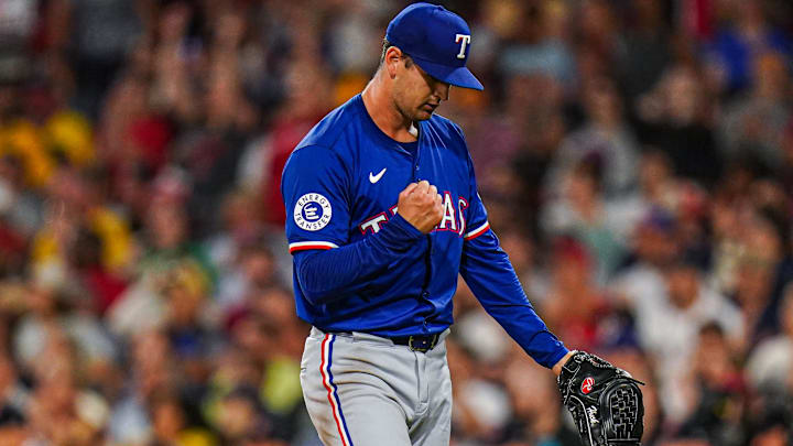 Aug 12, 2024; Boston, Massachusetts, USA; Texas Rangers starting pitcher Tyler Mahle (51) reacts after the final out against the Boston Red Sox in the fourth inning at Fenway Park