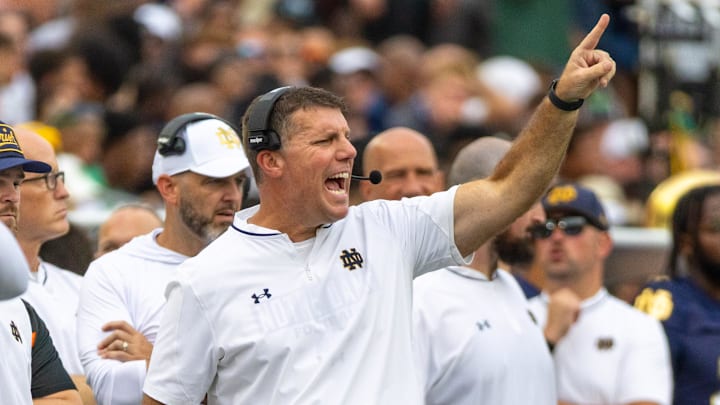 Sep 20, 2025; South Bend, Indiana, USA; Notre Dame Fighting Irish defensive coordinator Chris Ash shouts towards the field against the Purdue Boilermakers during the first half at Notre Dame Stadium. Sep 20, 2025; South Bend, Indiana, USA; Notre Dame Fighting Irish defensive coordinator Chris Ash shouts towards the field against the Purdue Boilermakers during the first half at Notre Dame Stadium.