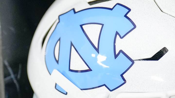 Dec 27, 2023; Charlotte, NC, USA; North Carolina Tar Heels white helmet during pregame warm ups against the West Virginia Mountaineers at Bank of America Stadium. Mandatory Credit: Jim Dedmon-USA TODAY Sports