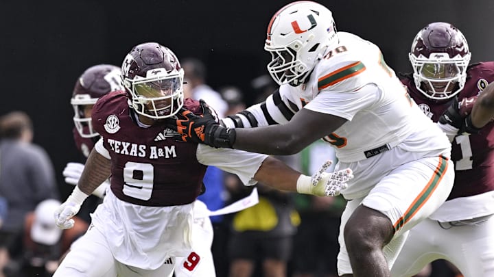 Texas A&M defensive end Cashius Howell (9) rushes the line past Miami Hurricanes offensive lineman Markel Bell (70) 