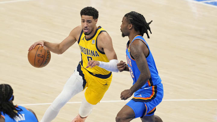 Haliburton dribbles the ball against Wallace during the 2025 NBA Finals at Paycom Center. 
