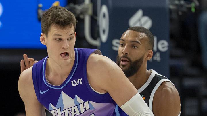 Mar 16, 2025; Minneapolis, Minnesota, USA; Utah Jazz center Walker Kessler (24) backs towards the basket as Minnesota Timberwolves center Rudy Gobert (27) plays defense in the first half at Target Center. Mandatory Credit: Jesse Johnson-Imagn Images