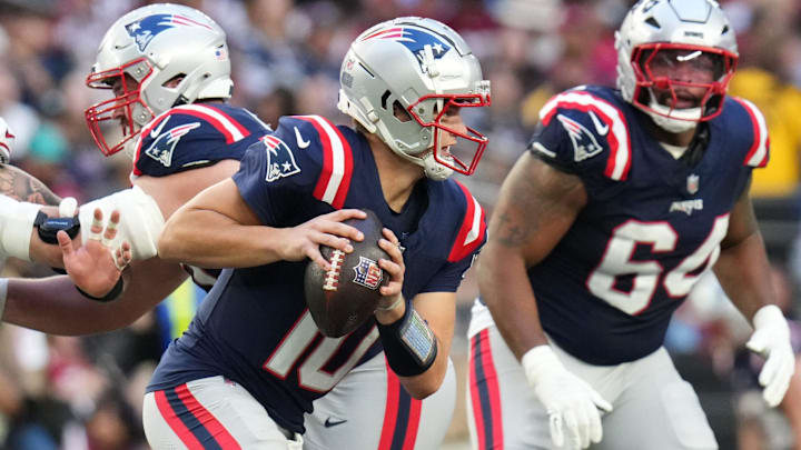New England Patriots quarterback Drake Maye (10) scrambles out of the pocket against the Arizona Cardinals at State Farm Stadium on Dec 15, 2024.