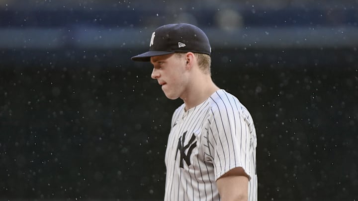 Sep 6, 2025; Bronx, New York, USA; New York Yankees first baseman Ben Rice (22) looks on as a steady rain begins to fall during the sixth inning against the Toronto Blue Jays at Yankee Stadium. Mandatory Credit: John Jones-Imagn Images