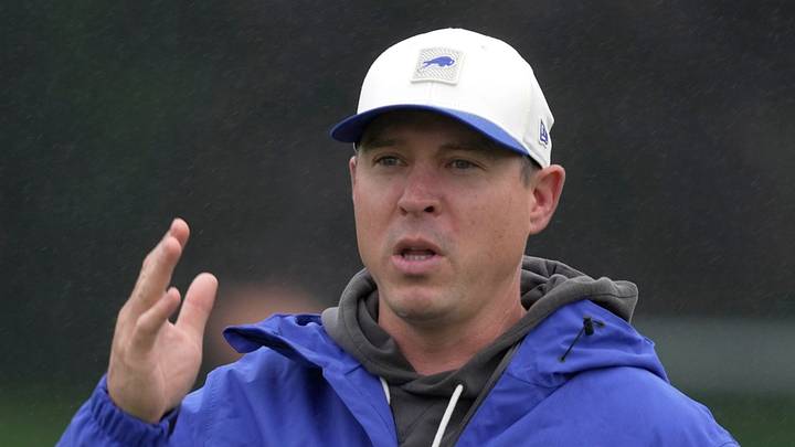 Bills defense coordinator Jim Leonhard talks to someone on the sidelines before practice at Bills Training Camp at St. John Fisher University in Pittsford on Aug. 13 2026.